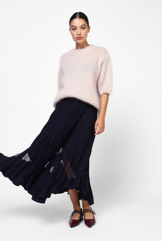 Pleated black skirt with translucent details