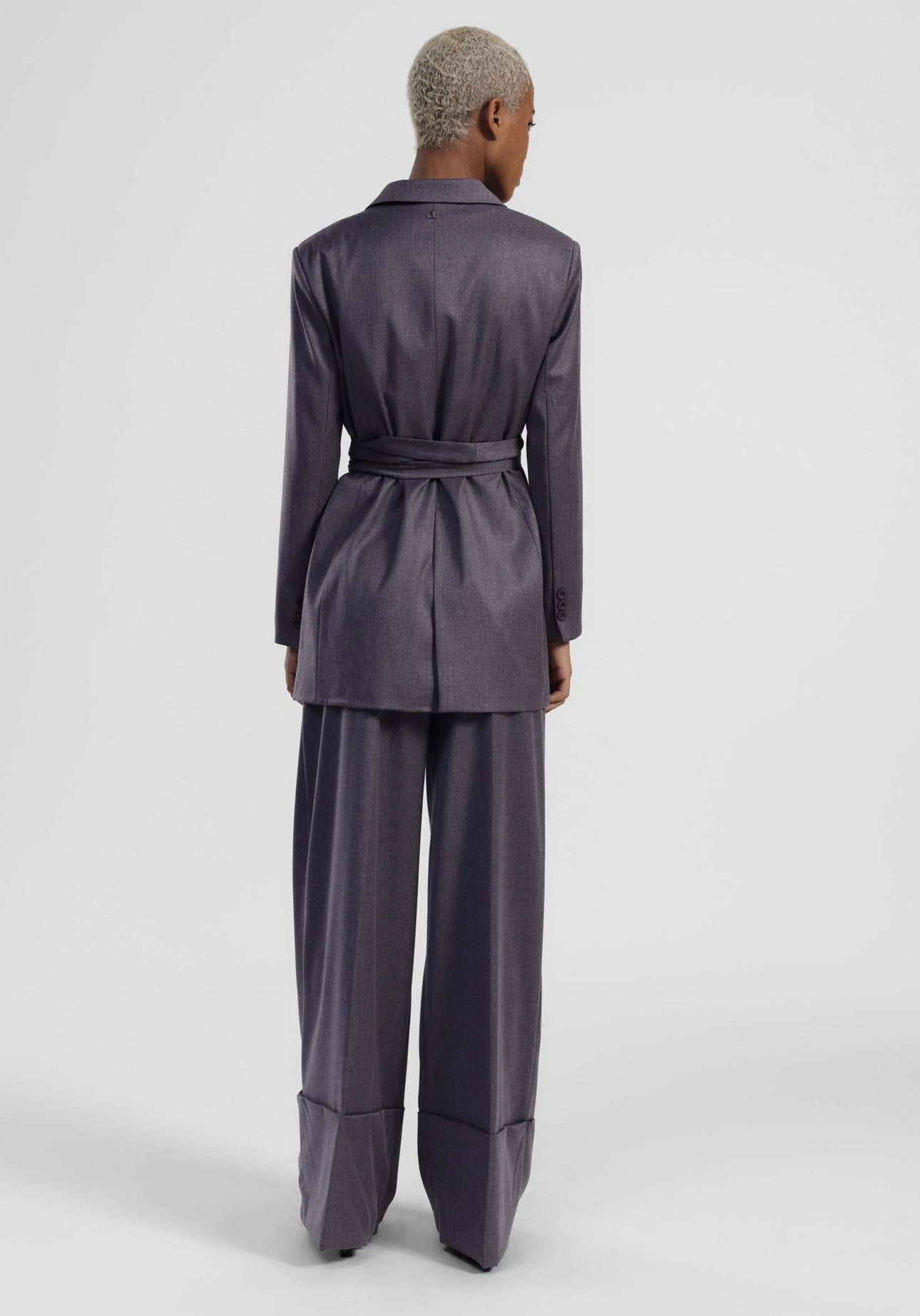 Suit with belted jacket and wide-leg trousers