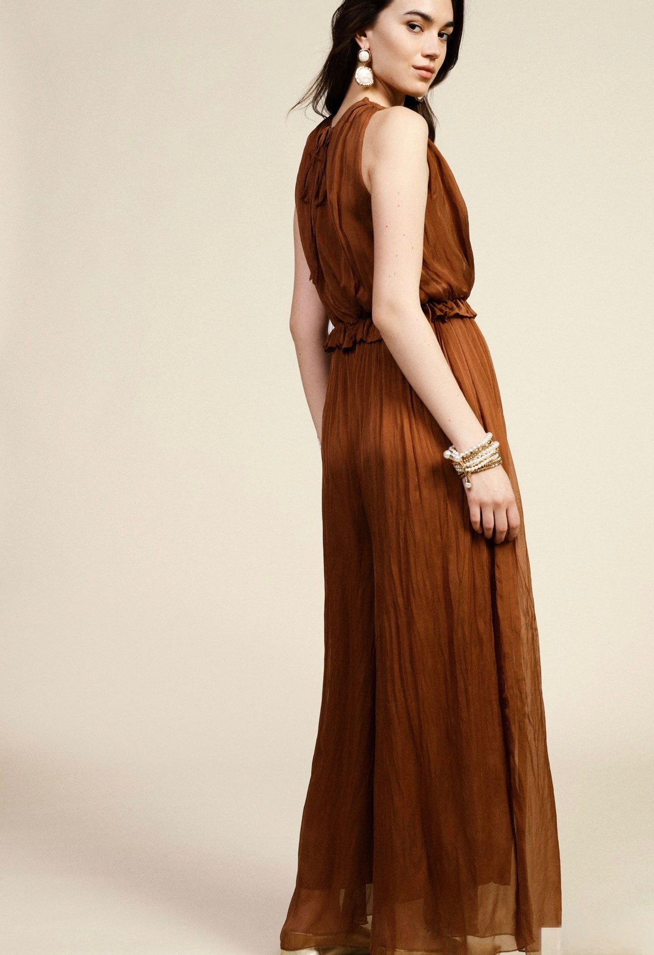 Sleeveless jumpsuit with v-neck and gathered waist