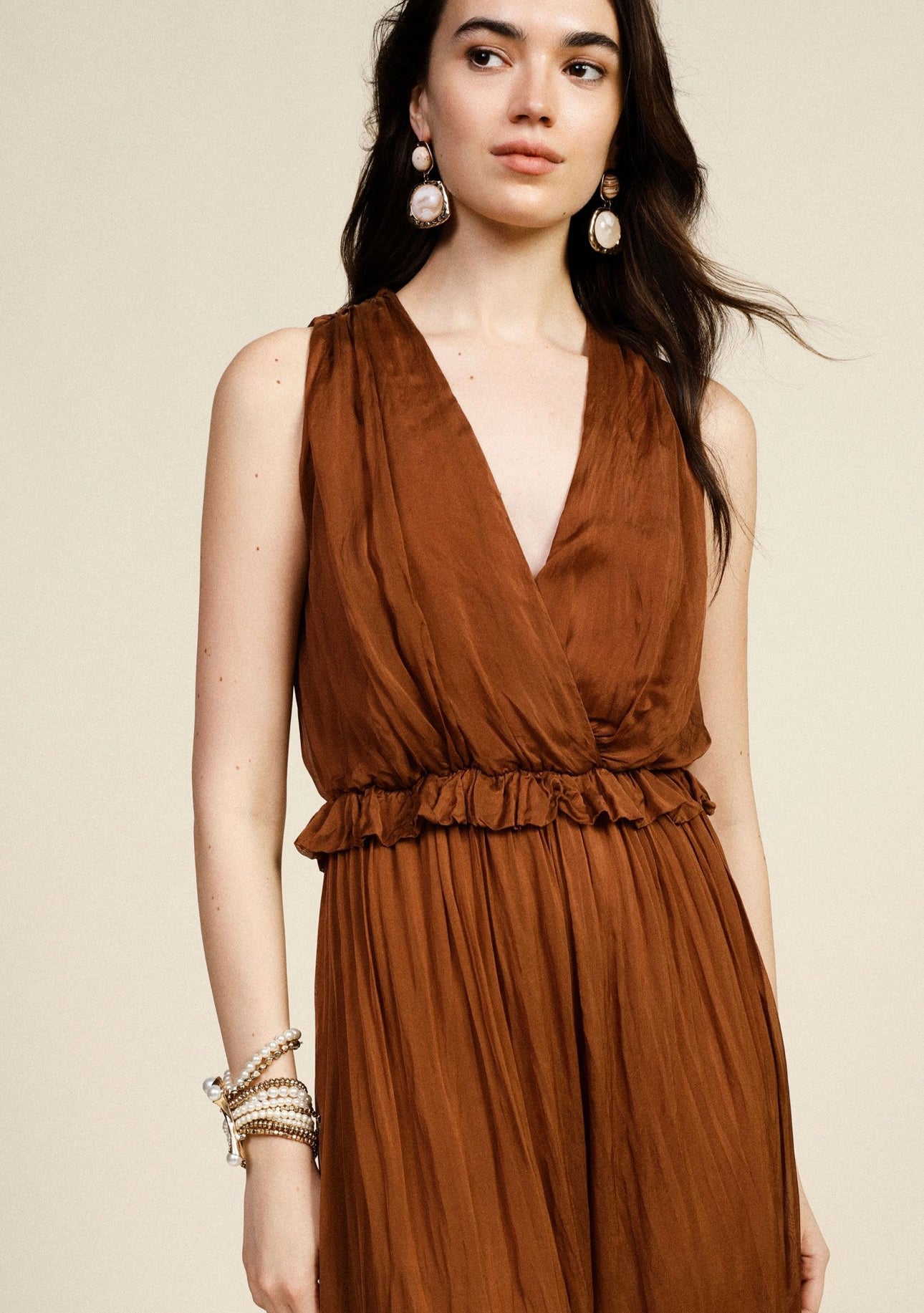 Sleeveless jumpsuit with v-neck and gathered waist